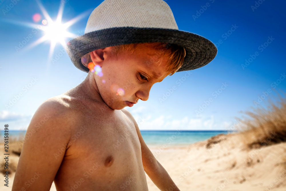 Small boy on beach and summer time. 