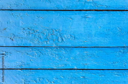 Old grunge background of weathered painted blue wooden plank. Vertical, copy space. Horizontal.