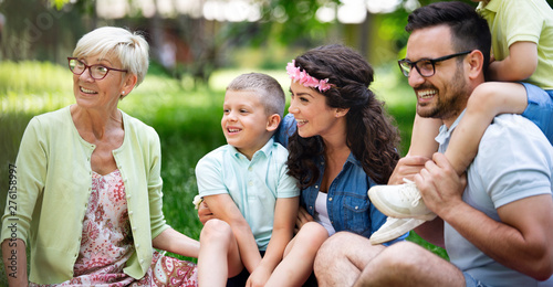 Happy family enjoying picnic in nature at summer