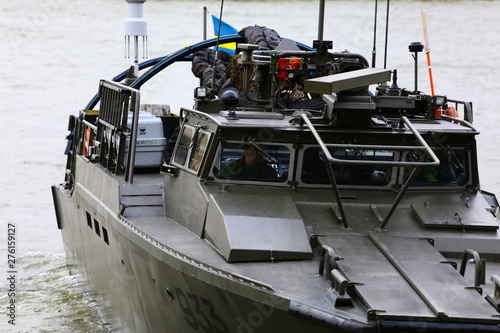 Navy day showing combat boats, automatic guns, UAV, drone, warships, handguns, dive boat etc