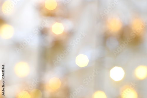 Bright white and yellow Christmas lights, an abstract festive background for holidays