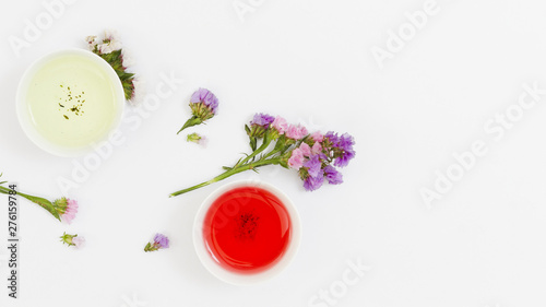 Top view cups of tea with flowers