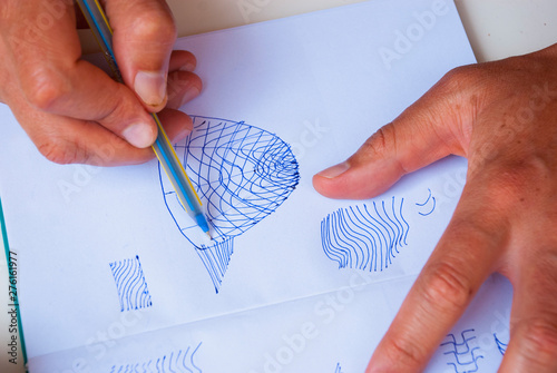 Abstract parametric lines of pen with man hands. Scetch background. photo