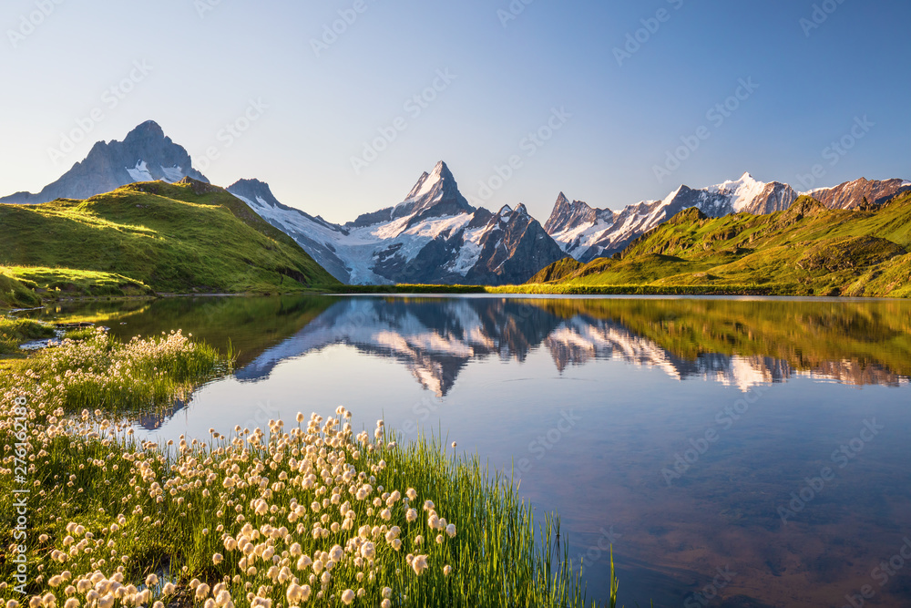 Sunrise  view on Bernese range above Bachalpsee lake. Popular tourist attraction. Location place Switzerland alps, Grindelwald valley, Europe. 