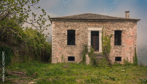 Abandoned house covered with ivy