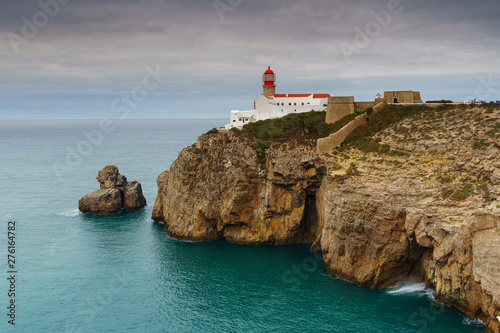 Landscape of the lighthouse and cliffs at Cape St. Vincent at sunset. Algarve amazing seascape.  Continental Europe's most South-western point, Sagres, Portugal.