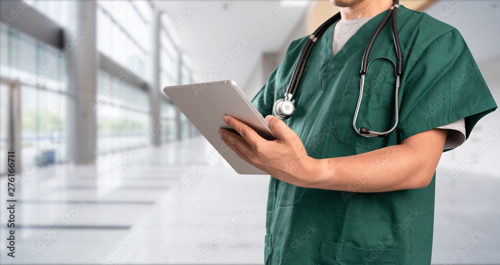 young doctor with hospital background young doctor with hospital background