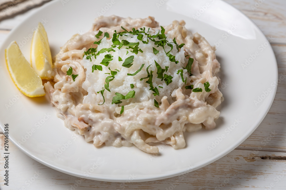 Squid in sour cream sauce. Greek national dish Squid in sour cream sauce. Greek national dish