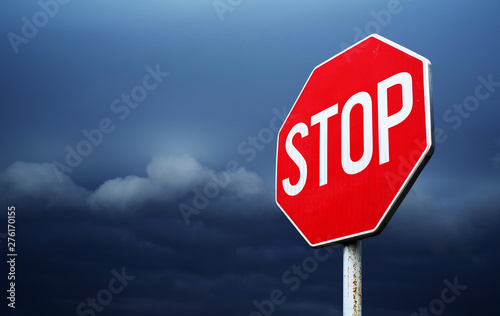 Leinwand Poster Conceptual stop sign with stormy background