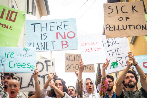 Public demonstration on the street against global warming and pollution. Group of multiethnic people making protest about climate change and plastic problems in the oceans © oneinchpunch