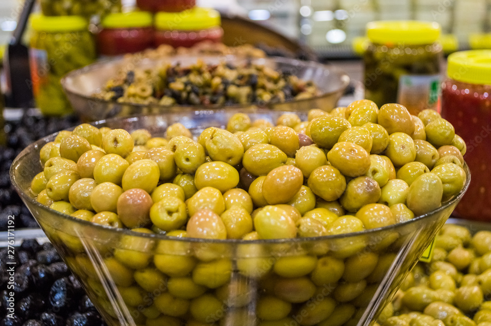 Fresh green olives for sale at local market