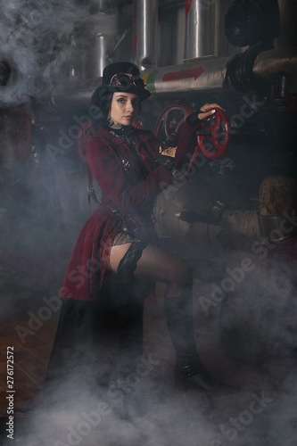 Attractive steampunk woman over industrial background