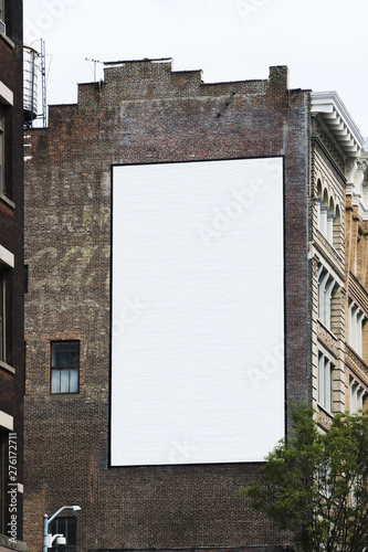 Big billboard template on building in city photo