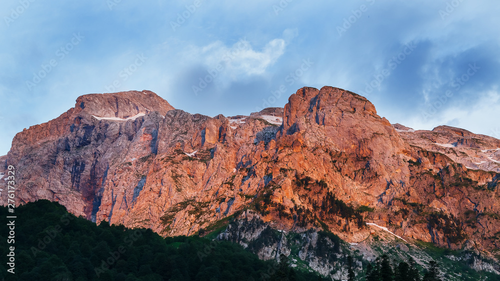 Scarlet high rocky mountain at sunset. Caucasian reserve, mountain Fisht, Krasnodar region