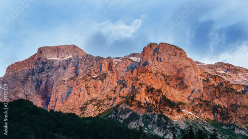 Scarlet high rocky mountain at sunset. Caucasian reserve, mountain Fisht, Krasnodar region
