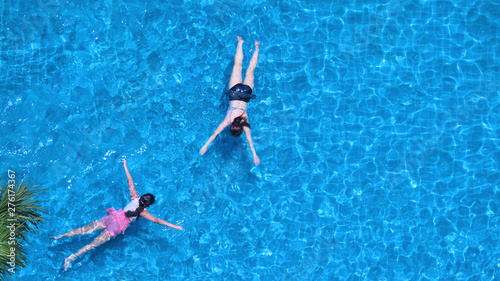Swimming pool top view angle which blue color clear water and sun light reflect on surface texture and concept images for relaxation or vacation or sport in the tropical summer and for healthy lifesty