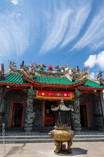 chinese temple roofs and dramatic clouds