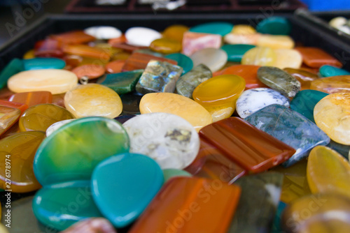 a collection of colorful crystals at the flea market