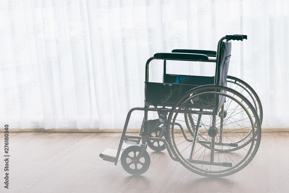 Wheelchair Parked on wooden floors with white curtains background, to health concept.