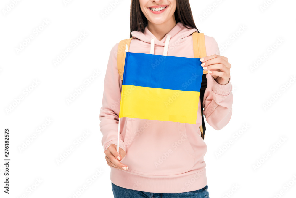 cropped view of smiling student with backpack holding Ukrainian flag isolated on white cropped view of smiling student with backpack holding Ukrainian flag isolated on white