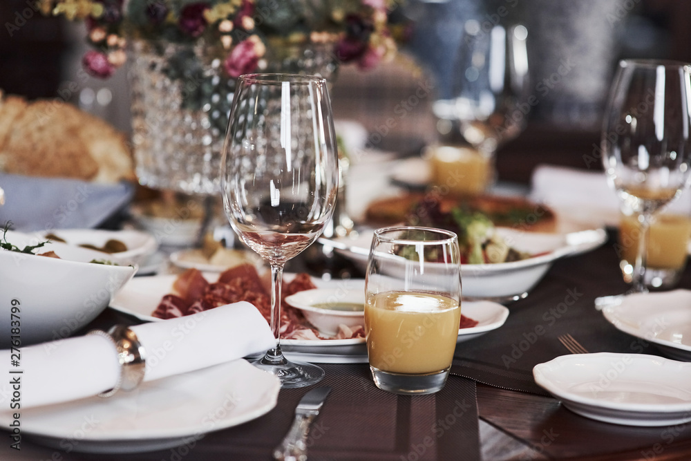 Close up photo of table with food and drinks in the beautiful restaurant