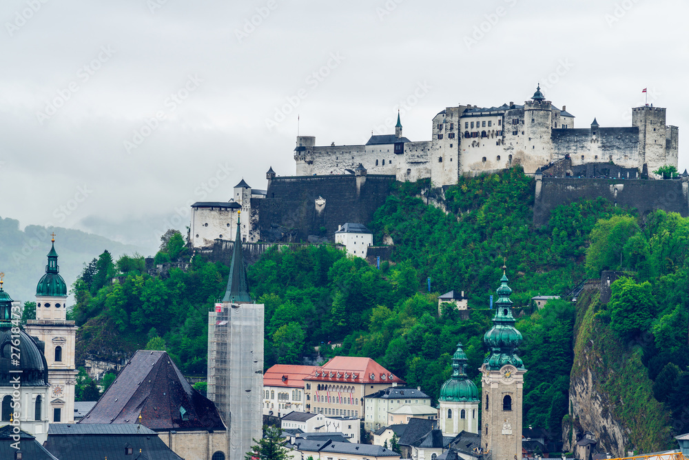 Salzburg Panorama on a gloomy and misty day. Austrian alps region beloved by tourists