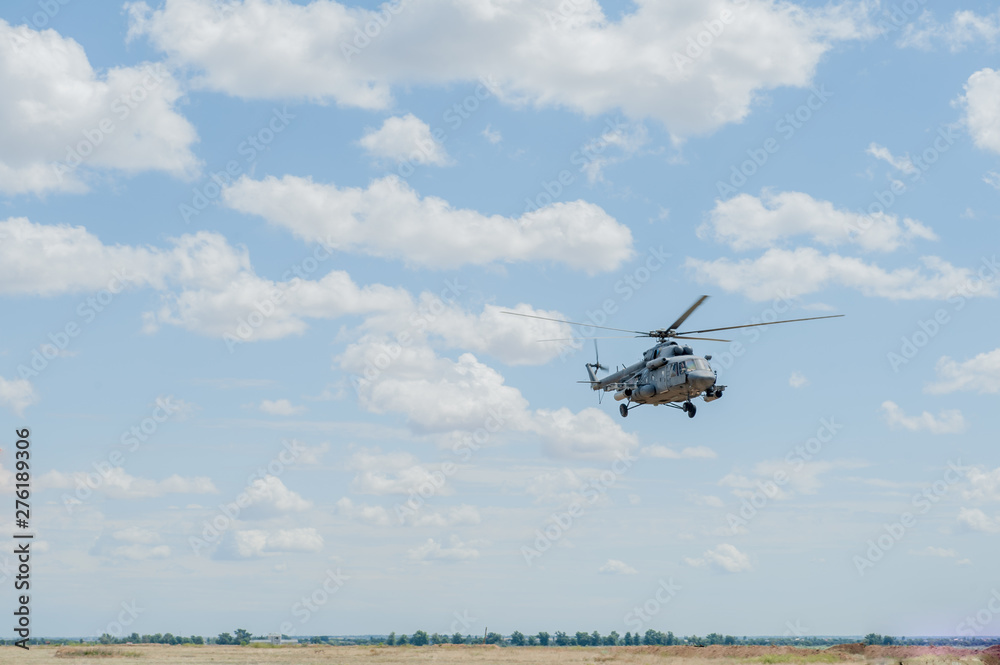 Flying military transport helicopter special for army soldier in fight war. Military soldier volant in transport helicopter above clean blue sky. Helicopter is military transport to army soldier Flying military transport helicopter special for army soldier in fight war. Military soldier volant in transport helicopter above clean blue sky. Helicopter is military transport to army soldier
