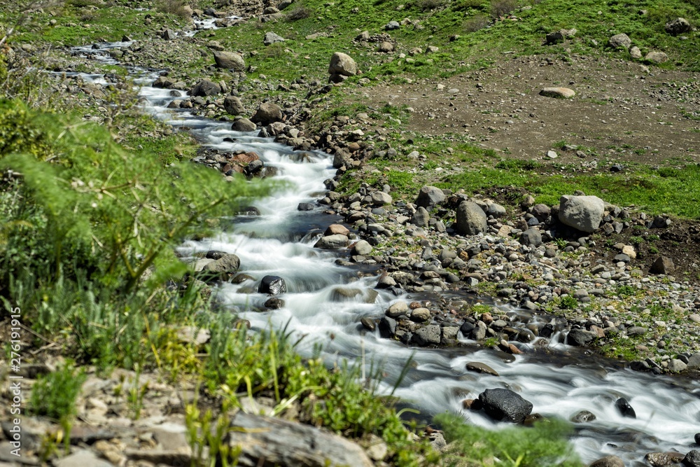Cascades on a creek in the mountains. A stunning spring mountain landscape. Mount Aragats. Armenia Cascades on a creek in the mountains. A stunning spring mountain landscape. Mount Aragats. Armenia