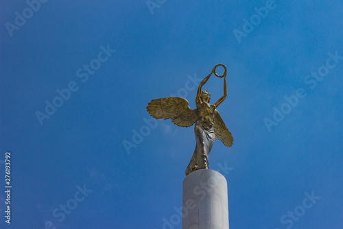 Golden winged goddess woman...