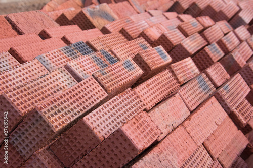  New red clay bricks for masonry building walls. Material for the construction of a new building. © Vasiliy Ulyanov