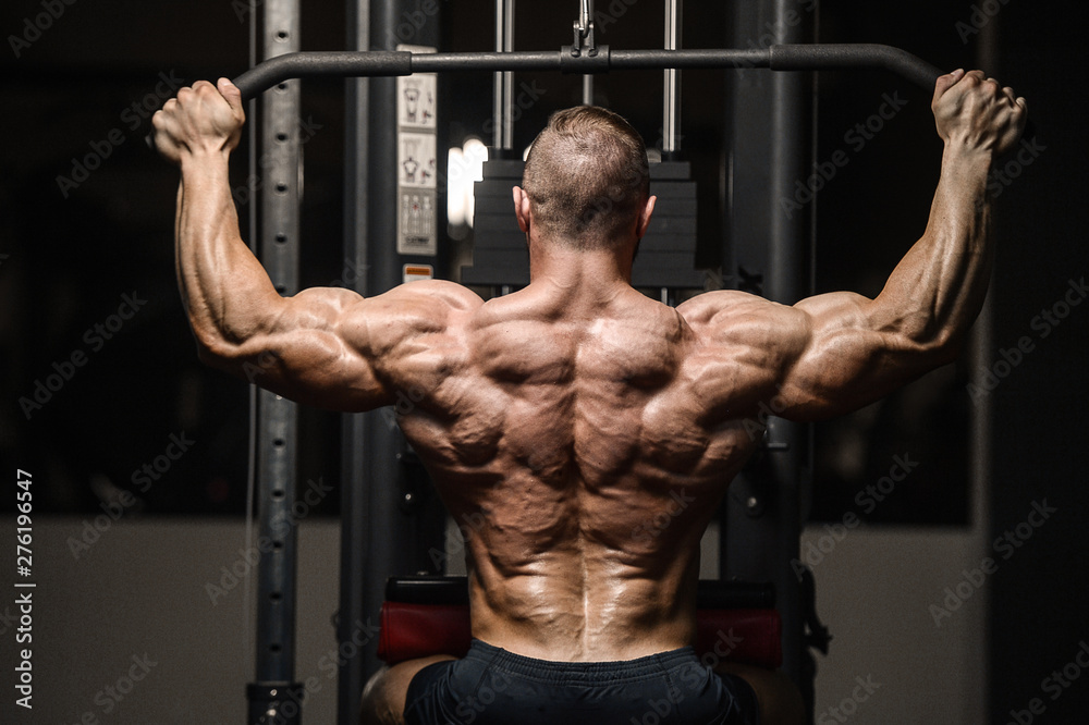 strong athletic men pumping up back muscles workout fitness strong athletic men pumping up back muscles workout fitness