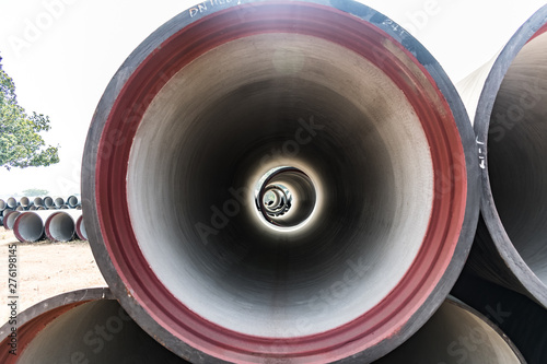 Photos single ductile iron pipe stored in open space store yard.