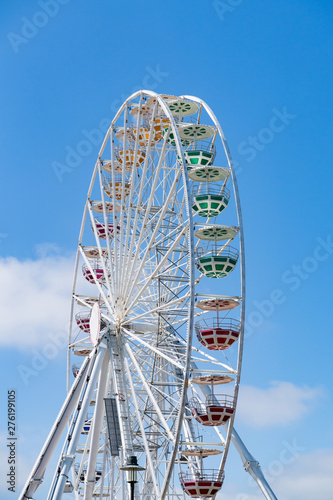 Ferris Mill, big wheel on a background of blue sky.