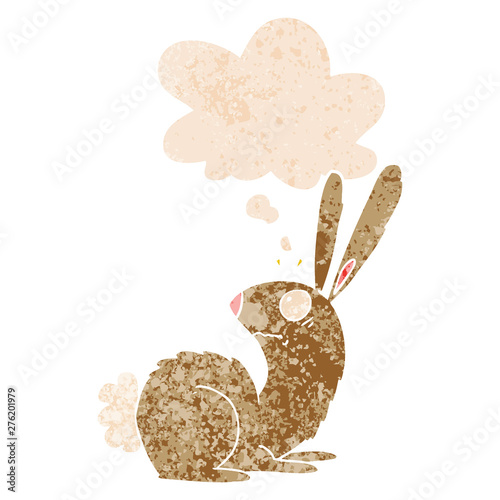 cartoon startled bunny rabbit and thought bubble in retro textured style