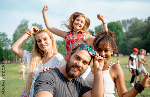 Friends on selfie photo from summer music festival