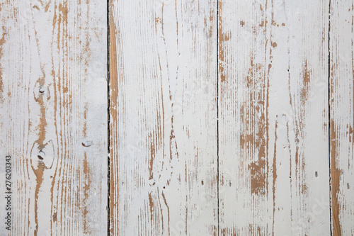 White wooden floorboards. Distressed worn floorboard background painted white