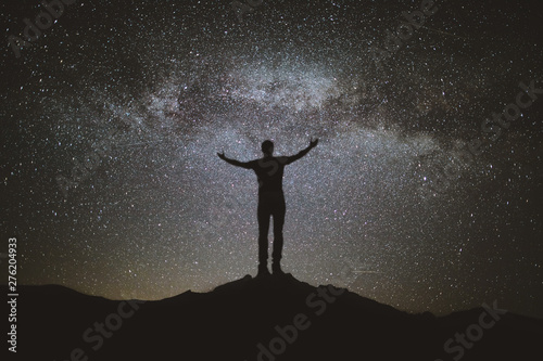 silhouette of man on a stars background