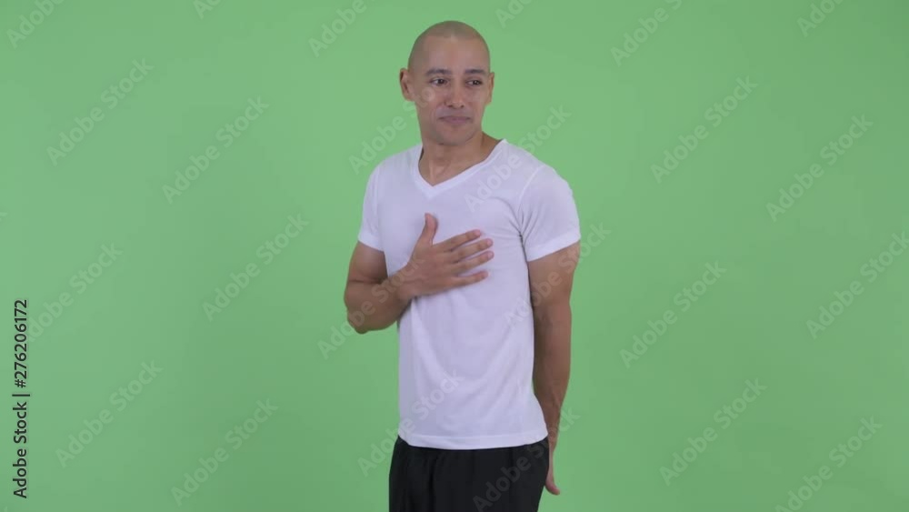 Funny handsome bald man farting and looking guilty Funny handsome bald man farting and looking guilty