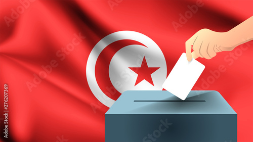 Male hand puts down a white sheet of paper with a mark as a symbol of a ballot paper against the background of the Tunisia flag, Tunisia the symbol of elections