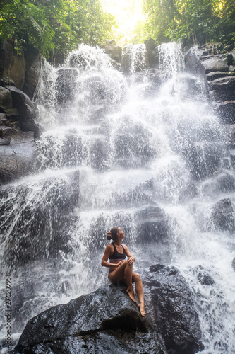 Woman near waterfal on Bali  Indonesia  