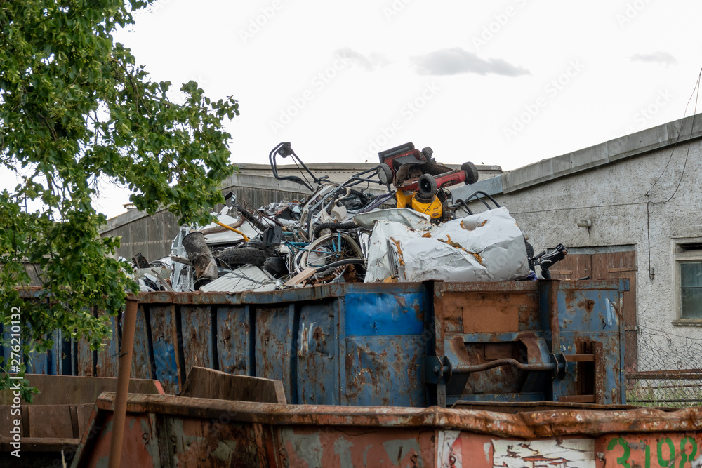 Metal scrap is located in large containers