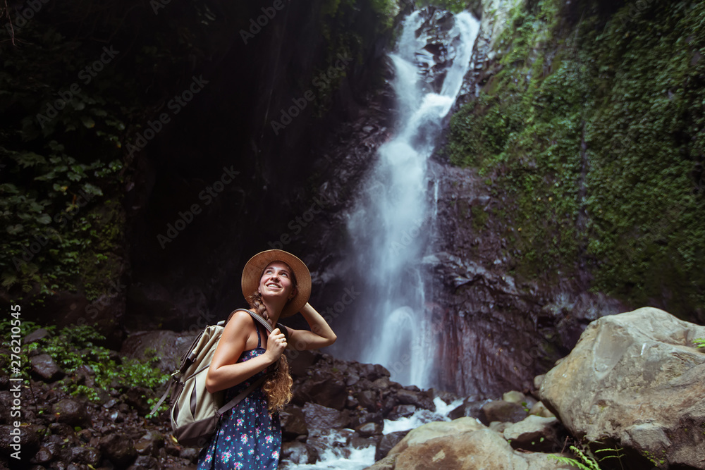 Woman near waterfal on Bali, Indonesia Woman near waterfal on Bali, Indonesia