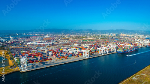 Oakland Harbor port terminal with cargo ship and shipping containers