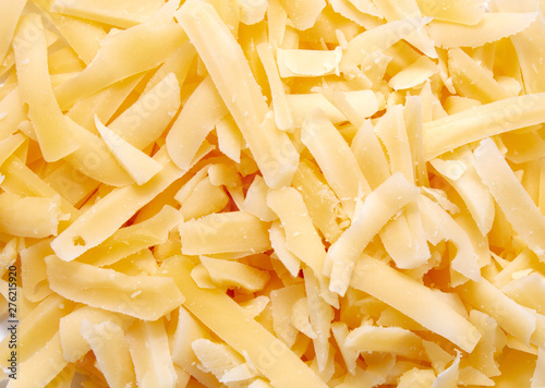 Delicious grated cheese on white background
