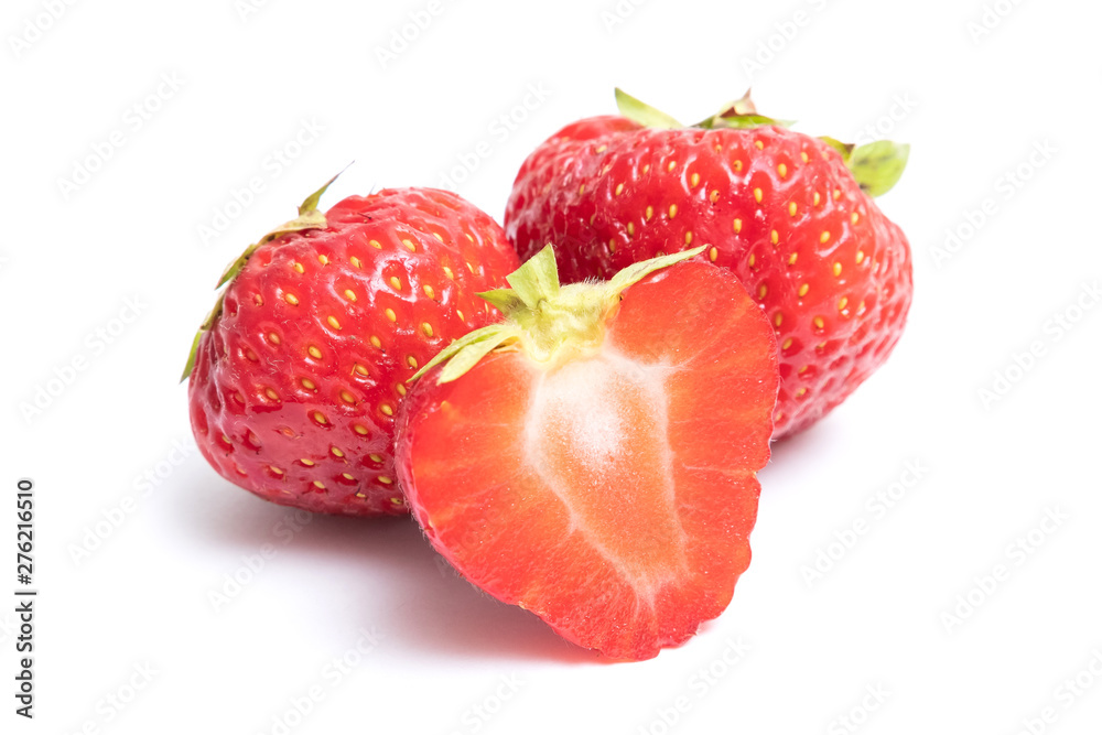 Isolated strawberries. Two whole strawberry fruits and half isolated on white background, with clipping path Isolated strawberries. Two whole strawberry fruits and half isolated on white background, with clipping path