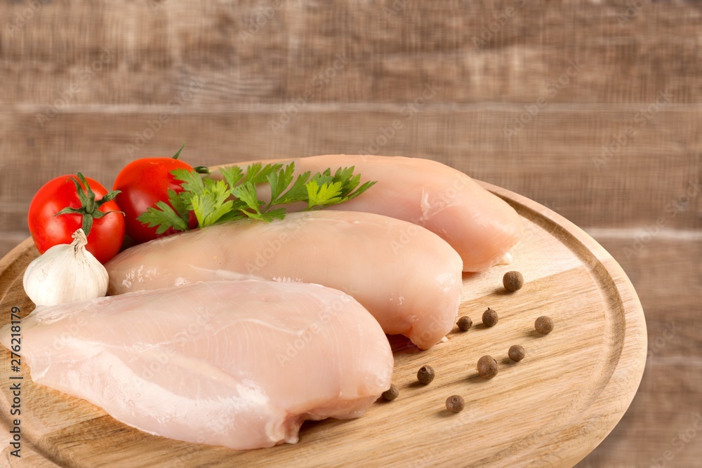 Raw Meat slices and knife on cutting board Raw Meat slices and knife on cutting board