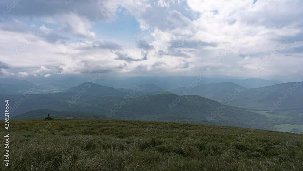 Time lapse of clouds moving fast over the mountain range. View from Tarnica, Bieszczady, Poland. Time lapse of clouds moving fast over the mountain range. View from Tarnica, Bieszczady, Poland.