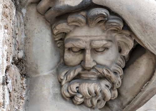 Stone sculpture of a hard man