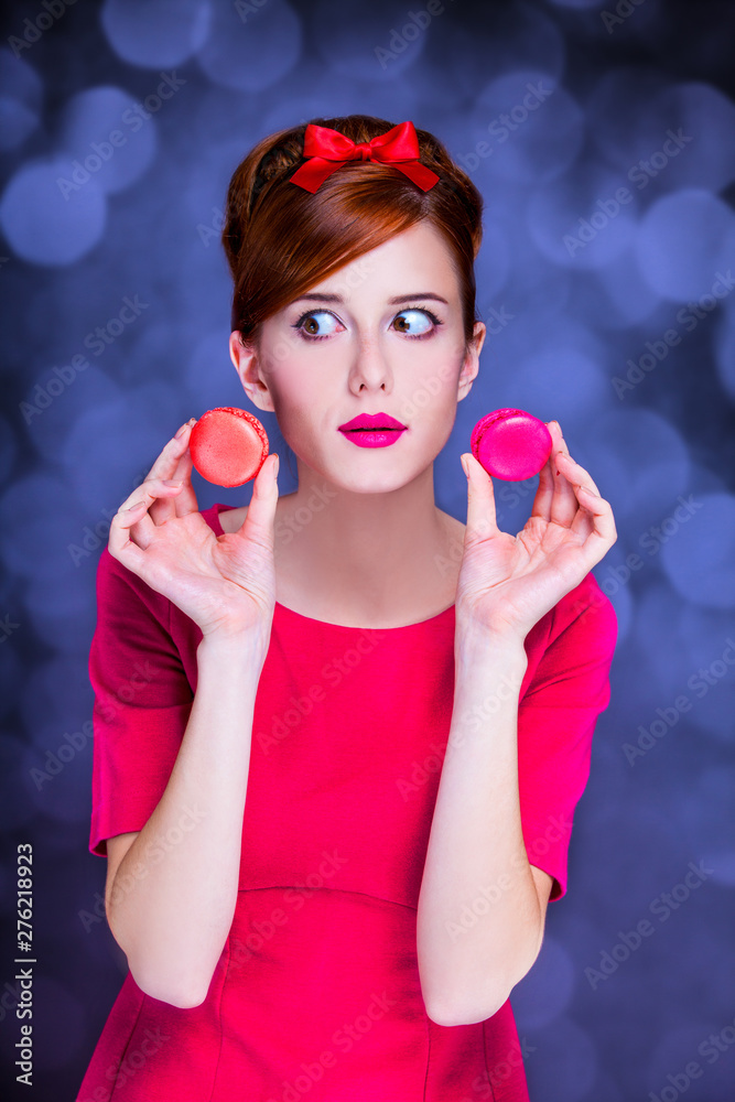 Redhead girl with macaron for St. Valentine Day. Redhead girl with macaron for St. Valentine Day.