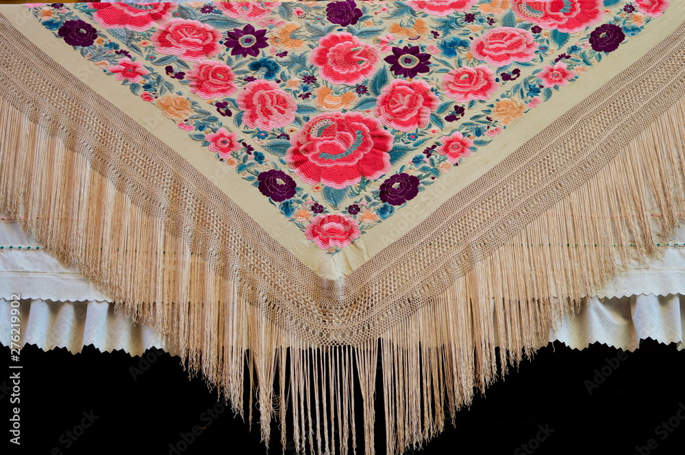 Obraz premium A floral colorful manila shawl in a balcony of Seville, Spain